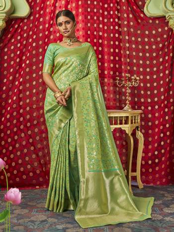 Celebrate This Festive Season In This Very Pretty Pistel Colored Designer Saree Paired With Contrasting Colored Blouse. This Saree and Blouse Are Banarasi Silk Based Beautified Wevon Jacquard Designer Saree. 