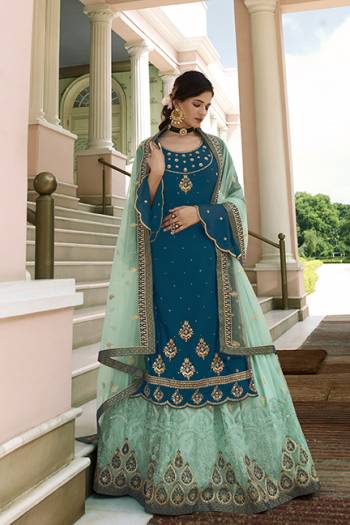 Beautiful looks in this Fine COLOR fabric On Art Silk with inner  and SHARARA semi stiched type and bottom chudidar style suit with embroidered floral patterns on the yoke and sleeves. Comes with matching dupatta.