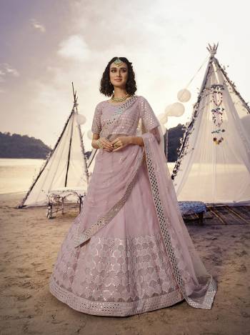 Heavy Designer Lehenga Choli In Light Base Color Fabricated On Organza Beautified With Heavy Attractive Embroidery With Mirror And Soft Net Dupatta. 