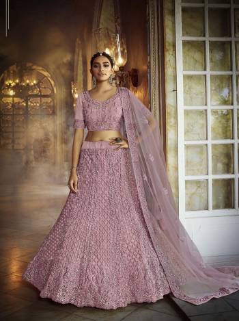 Heavy Designer Lehenga Choli & Dupatta In Light Base Color Fabricated On Soft Net Beautified With Heavy Attractive Dori & Zarkan Embroidery Work. 