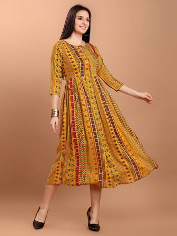 Grab This Readymade Long Kurti In Fine Color Fabricated On Rayon Beautified With Printed. It Is Light In Weight And Easy To Carry All Day Long. 