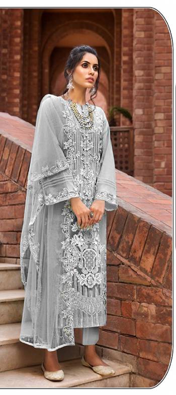 Grab This Attractive Looking Heavy Designer Straight Suit In Light Color. Its Embroidered Top And Dupatta Are Butterfly Net Based Paired With Santoon Bottom. Buy This Pretty Suit Now