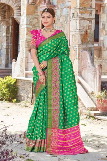 Grab This Pretty Elegant Looking Designer Saree In With Contrasting Colored Blouse. This Saree And Blouse Are Handloom Silk Based Beautified With Wevon Jari Jacquard And Stone Work. Buy Now.