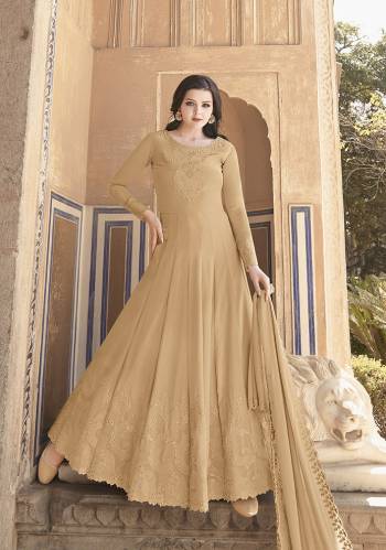 Grab This Heavy Designer Floor Length Suit Is In Attractive Pastel Fawn Color. Its Heavy Embroidered Top Is Fabricated On Soft Georgette Paired With Dull Santoon Bottom And Soft Georgette Fabricated Dupatta. Buy This Lovely Embroidered Floor Length Suit Now