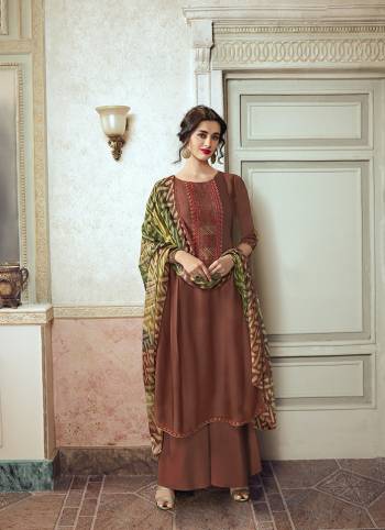 Simple And Elegant Designer Suit Is Here In Embroidery Work with Digital Prints With Mukeish Work In Dupatta. This Suit Is In All Over Base Color Whose Top Is Satin Georgette Based Paired With Santoon Bottom And Brasso Fabricated Dupatta. 