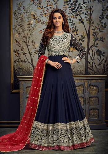 Add This Very Pretty Heavy Designer Floor Length Suit To Your Wardrobe In All Over Color. Its Heavy Embroidered And Swaroski Top IS Fabricated On Georgette Paired With Santoon Bottom And Net Fabricated Dupatta. It Is Light In Weight And Easy To Carry Throughout The Gala. Buy Now. 

