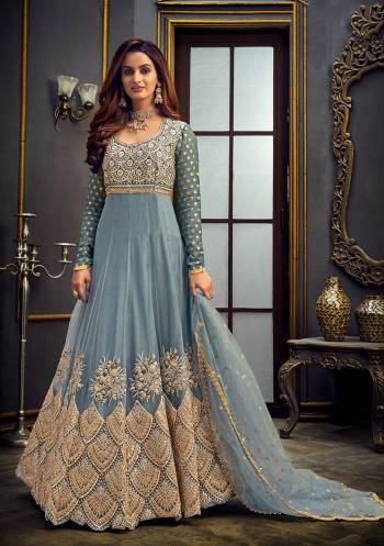 Add This Very Pretty Heavy Designer Floor Length Suit To Your Wardrobe In All Over Color. Its Heavy Embroidered And Swaroski Top IS Fabricated On Butterfly Net Paired With Santoon Bottom And Net Fabricated Dupatta. It Is Light In Weight And Easy To Carry Throughout The Gala. Buy Now. 

