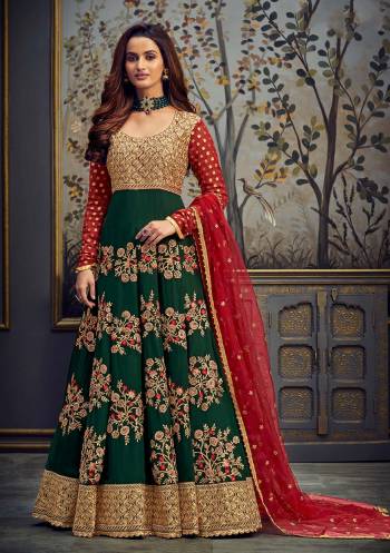 Add This Very Pretty Heavy Designer Floor Length Suit To Your Wardrobe In All Over Color. Its Heavy Embroidered And Swaroski Top IS Fabricated On Georgette Paired With Santoon Bottom And Net Fabricated Dupatta. It Is Light In Weight And Easy To Carry Throughout The Gala. Buy Now. 

