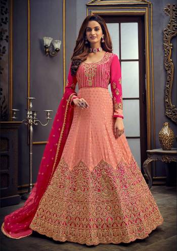 Add This Very Pretty Heavy Designer Floor Length Suit To Your Wardrobe In All Over Color. Its Heavy Embroidered And Swaroski Top IS Fabricated On Viscose Jacquard Butti Paired With Santoon Bottom And Net Fabricated Dupatta. It Is Light In Weight And Easy To Carry Throughout The Gala. Buy Now. 

