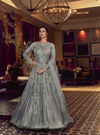 Grab This Very Beautiful Heavy Designer Floor Length Suit In Fine Color. Its Top Is Fabricated On Butterfly Net Paired With Soft Silk Bottom and Butterfly Net Fabricated Dupatta. It Is Beautified With Tone To Tone Embroidery All Over. Buy Now. 

