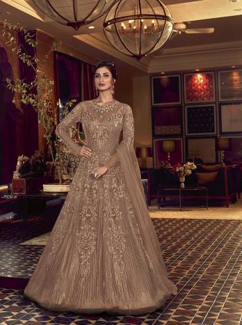 Grab This Very Beautiful Heavy Designer Floor Length Suit In Fine Color. Its Top Is Fabricated On Butterfly Net Paired With Soft Silk Bottom and Butterfly Net Fabricated Dupatta. It Is Beautified With Tone To Tone Embroidery All Over. Buy Now. 

