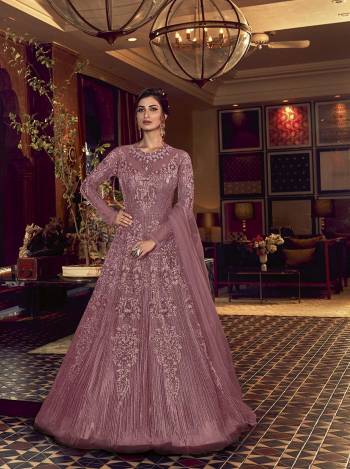 Grab This Very Beautiful Heavy Designer Floor Length Suit In Fine Color. Its Top Is Fabricated On Butterfly Net Paired With Soft Silk Bottom and Butterfly Net Fabricated Dupatta. It Is Beautified With Tone To Tone Embroidery All Over. Buy Now. 

