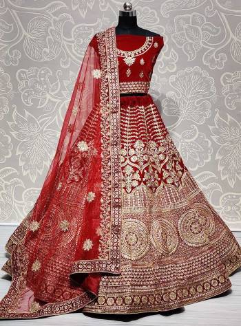 Heavy Designer Lehenga Choli In Red Color Fabricated On Velvet Beautified With Heavy Attractive Embroidery And Dupatta Are Soft Net In Red Color. 