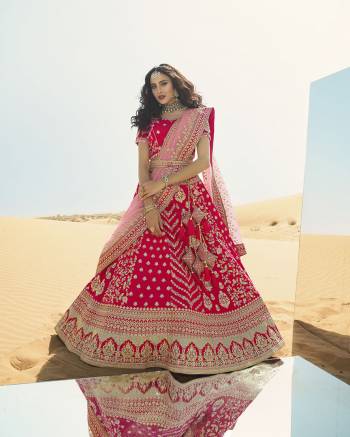 Heavy Designer Lehenga Choli In Attrective Color Fabricated On Raw Silk Beautified With Heavy Attractive Embroidery And Stone Work And Dupatta Are Net  With Belt And Matching Latkan. 