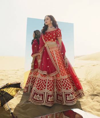 Heavy Designer Lehenga Choli In Attrective Color Fabricated On Raw Silk Beautified With Heavy Attractive Embroidery And Stone Work And Dupatta Are Net  With Belt And Matching Latkan. 