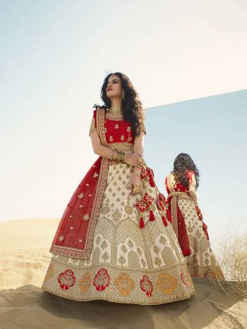 Heavy Designer Lehenga Choli In Attrective Color Fabricated On Raw Silk Beautified With Heavy Attractive Embroidery And Stone Work And Dupatta Are Net  With Belt And Matching Latkan. 