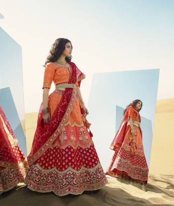 Heavy Designer Lehenga Choli In Attrective Color Fabricated On Raw Silk Beautified With Heavy Attractive Embroidery And Stone Work And Dupatta Are Net  With Belt And Matching Latkan. 