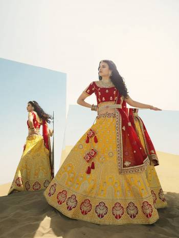 Heavy Designer Lehenga Choli In Attrective Color Fabricated On Raw Silk Beautified With Heavy Attractive Embroidery And Stone Work And Dupatta Are Net  With Belt And Matching Latkan. 