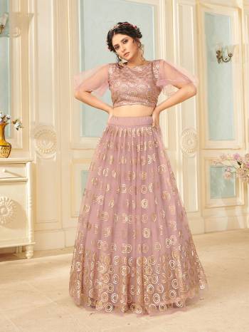 Heavy Designer Lehenga Choli And Dupatta In Light Color Fabricated On Soft Net Beautified With Heavy Attractive Sequance Thread Dori Embroidery. 