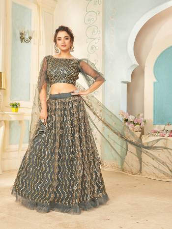 Heavy Designer Lehenga Choli And Dupatta In Light Color Fabricated On Soft Net Beautified With Heavy Attractive Sequance Thread Dori Embroidery. 