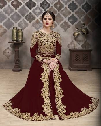 Here Is A Very Pretty Designer Indo-Western Suit In Dark Colored Top, Bottom, Dupatta. Its Heavy Embroidered And Stone Work Top Is Fabricated On Faux Georgette Paired With Santoon Bottom And Chiffon Fabricated Dupaata. Buy This Lehenga Suit Now. 