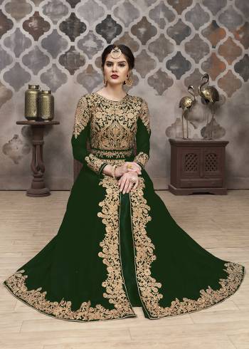 Here Is A Very Pretty Designer Indo-Western Suit In Dark Colored Top, Bottom, Dupatta. Its Heavy Embroidered And Stone Work Top Is Fabricated On Faux Georgette Paired With Santoon Bottom And Chiffon Fabricated Dupaata. Buy This Lehenga Suit Now. 