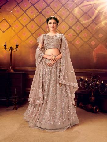 Here Is A Very Pretty Heavy Designer Lehenga Choli For The Bridesmaid In This Lovely Color. This Detailed Embroidered Lehenga Choli And Dupatta Are Fabricated On Soft Net Which Is Light Weight, Durable And Gives A Pretty Look The Personality. Buy This Pretty Piece Now. 

