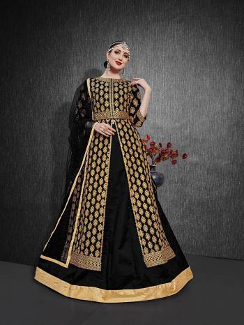 Here Is A Royal Looking Heavy Designer Floor Length Suit In Black Color. Its Heavy Embroidered Top Is Fabricated On Heavy Silk Paired With Santoon Fabricated Bottom And Net Fabricated Dupatta. Its Royal Color and Pattern Will Earn You Lots Of Compliments From Onlookers. 

