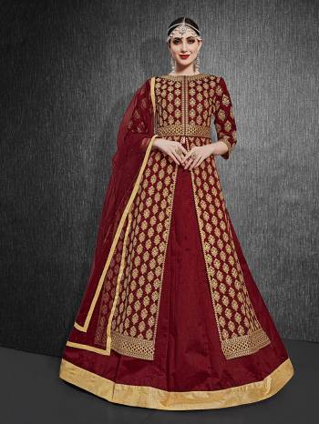 Here Is A Royal Looking Heavy Designer Floor Length Suit In Maroon Color. Its Heavy Embroidered Top Is Fabricated On Heavy Silk Paired With Santoon Fabricated Bottom And Net Fabricated Dupatta. Its Royal Color and Pattern Will Earn You Lots Of Compliments From Onlookers. 

