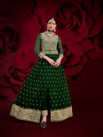 Here Is A Royal Looking Heavy Designer Floor Length Suit In Green Color. Its Heavy Embroidered Top Is Fabricated On Heavy Silk Paired With Santoon Fabricated Bottom And Net Fabricated Dupatta. Its Royal Color and Pattern Will Earn You Lots Of Compliments From Onlookers. 

