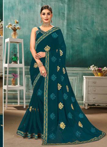 Grab This Pretty Elegant Looking Designer Saree In Fine Color Paired With Maching Colored Blouse. This Saree Are Sahi Chiffon And Blouse Are Art Silk Based Beautified With Embroidery Butta And Embroidery Lace Border. Buy Now.