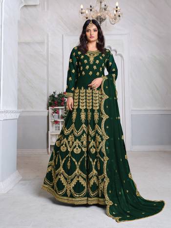 Look Pretty This Designer Floor Length Suit In Lovely Green Color.?Its Pretty Heavy Jari Embroidred Top Is Faux Georgette Based Paired With Santoon Bottom And Faux Georgette Fabricated Embroidered Dupatta Which Gives An Attractive To The Suit.