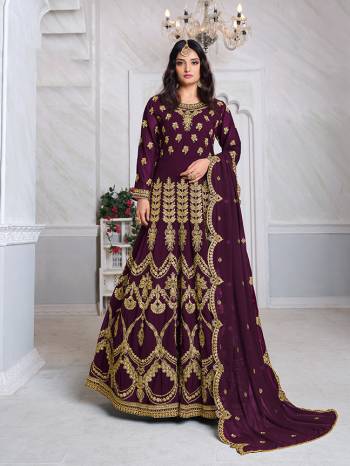 Look Pretty This Designer Floor Length Suit In Lovely Wine Color.?Its Pretty Heavy Jari Embroidred Top Is Faux Georgette Based Paired With Santoon Bottom And Faux Georgette Fabricated Embroidered Dupatta Which Gives An Attractive To The Suit.