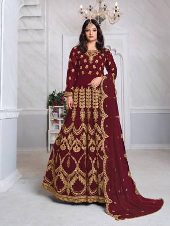 Look Pretty This Designer Floor Length Suit In Lovely Maroon Color.?Its Pretty Heavy Jari Embroidred Top Is Faux Georgette Based Paired With Santoon Bottom And Faux Georgette Fabricated Embroidered Dupatta Which Gives An Attractive To The Suit.