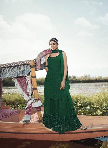 Attract All Wearing This Designer Suit In Green Color. Its Pretty Top Is Fabricated On Georgette Paired With Georgette Fabricated Bottom and Net Dupatta. This Suit's Top, Bottom And Dupatta Are Beautified With Detailed Heavy Embroidery. Buy This Pretty Piece Now.