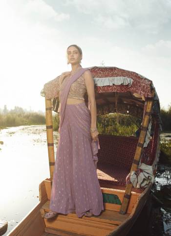 Attract All Wearing This Designer Suit In Levender Color. Its Pretty Top Is Fabricated On Georgette Paired With Georgette Fabricated Bottom and Net Dupatta. This Suit's Top, Bottom And Dupatta Are Beautified With Detailed Heavy Embroidery. Buy This Pretty Piece Now.