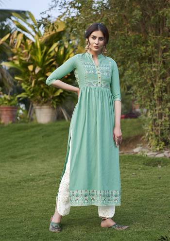 Grab This Readymade Long Kurti In Sea Green Color Fabricated On Rayon Beautified With Prints And Hand Work Bottom Are Masleen With Lakhnavi Work. It Is Light In Weight And Easy To Carry All Day Long. 