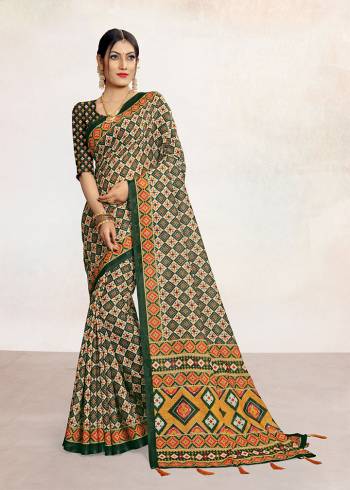 Look Attractive Wearing This Colored Saree Paired With Contrsted Colored Blouse.  This Printed Saree Is Linen Based Which Gives A Rich Look To Your Personality. Buy This Pretty Saree Now.