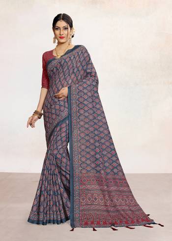 Look Attractive Wearing This Colored Saree Paired With Contrsted Colored Blouse.  This Printed Saree Is Linen Based Which Gives A Rich Look To Your Personality. Buy This Pretty Saree Now.