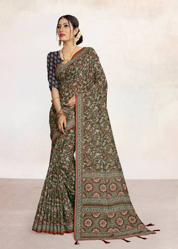 Look Attractive Wearing This Colored Saree Paired With Contrsted Colored Blouse.  This Printed Saree Is Linen Based Which Gives A Rich Look To Your Personality. Buy This Pretty Saree Now.