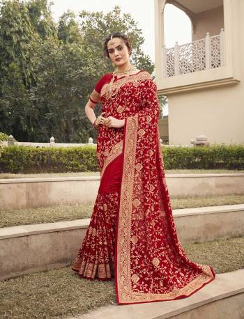 Celebrate This Festive Season In This Very Pretty Red Colored Designer Saree Paired With Blouse. This Saree and Blouse Are Vichitra Silk Based Beautified With Detailed Heavy Embroidery And Diamond Work. 