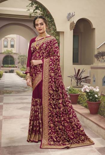 Celebrate This Festive Season In This Very Pretty Wine Colored Designer Saree Paired With Blouse. This Saree and Blouse Are Vichitra Silk Based Beautified With Detailed Heavy Embroidery And Diamond Work. 