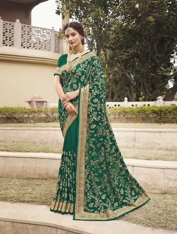 Celebrate This Festive Season In This Very Pretty Green Colored Designer Saree Paired With Blouse. This Saree and Blouse Are Vichitra Silk Based Beautified With Detailed Heavy Embroidery And Diamond Work. 