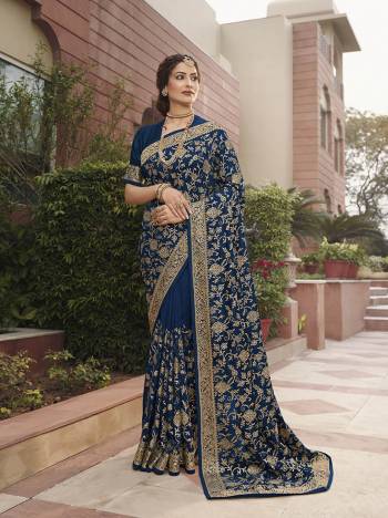 Celebrate This Festive Season In This Very Pretty Nevy Blue Colored Designer Saree Paired With Blouse. This Saree and Blouse Are Vichitra Silk Based Beautified With Detailed Heavy Embroidery And Diamond Work. 