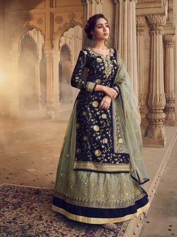 Look Pretty In This Heavy Designer Lehenga Choli In All Over Fine Color. Its Blouse Are Dola Jacquard Wevon And Lehenga Are Fabricated On Net Paired With Net Fabricated Dupatta. It Is Beautified With Heavy Embroidery And Diamond Work Giving It An Attractive Look.

