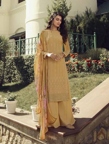 Look Pretty This Designer Long Suit In Lovely Dusty Yellow Color.?Its Pretty Embroidred,Lakhnovi Work And Ston Work Top Is Georgette Based Paired With Santoon Bottom And Georgette Fabricated Digital Print Dupatta Which Gives An Attractive To The Suit.