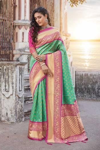 Adorn The Pretty Angelic Look Wearing This Heavy Wevon Designer Saree In Fine Color Paired With Contrasting  Colored Blouse. This Saree Is Fabricated On Silk Paired With Silk Fabricated Blouse. Its Pretty Color Pallete Will Give An Attractive Look To Your Personality. 