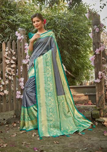 Celebrate This Festive Season In This Very Pretty Colored Designer Saree Paired With Contrasting Colored Blouse. This Saree and Blouse Silk Based Beautified With Detailed Wevon Jari Jacquard Work. 