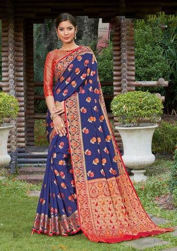 Look Attractive Wearing This Nevy Blue Colored Saree Paired With Maroon Colored Blouse.  This Heavy Designer Saree Is Banarasi Silk Based Which Gives A Rich Look To Your Personality. Buy This Pretty Saree Now.