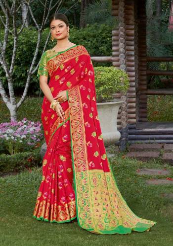 Look Attractive Wearing This Red Colored Saree Paired With Green Colored Blouse.  This Heavy Designer Saree Is Banarasi Silk Based Which Gives A Rich Look To Your Personality. Buy This Pretty Saree Now.